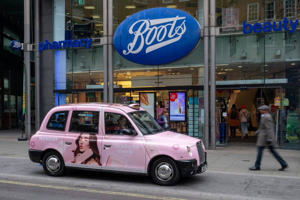 An example of taxi advertising for a shampoo brand, targeting specific retailers e.g. Boots in the UK.