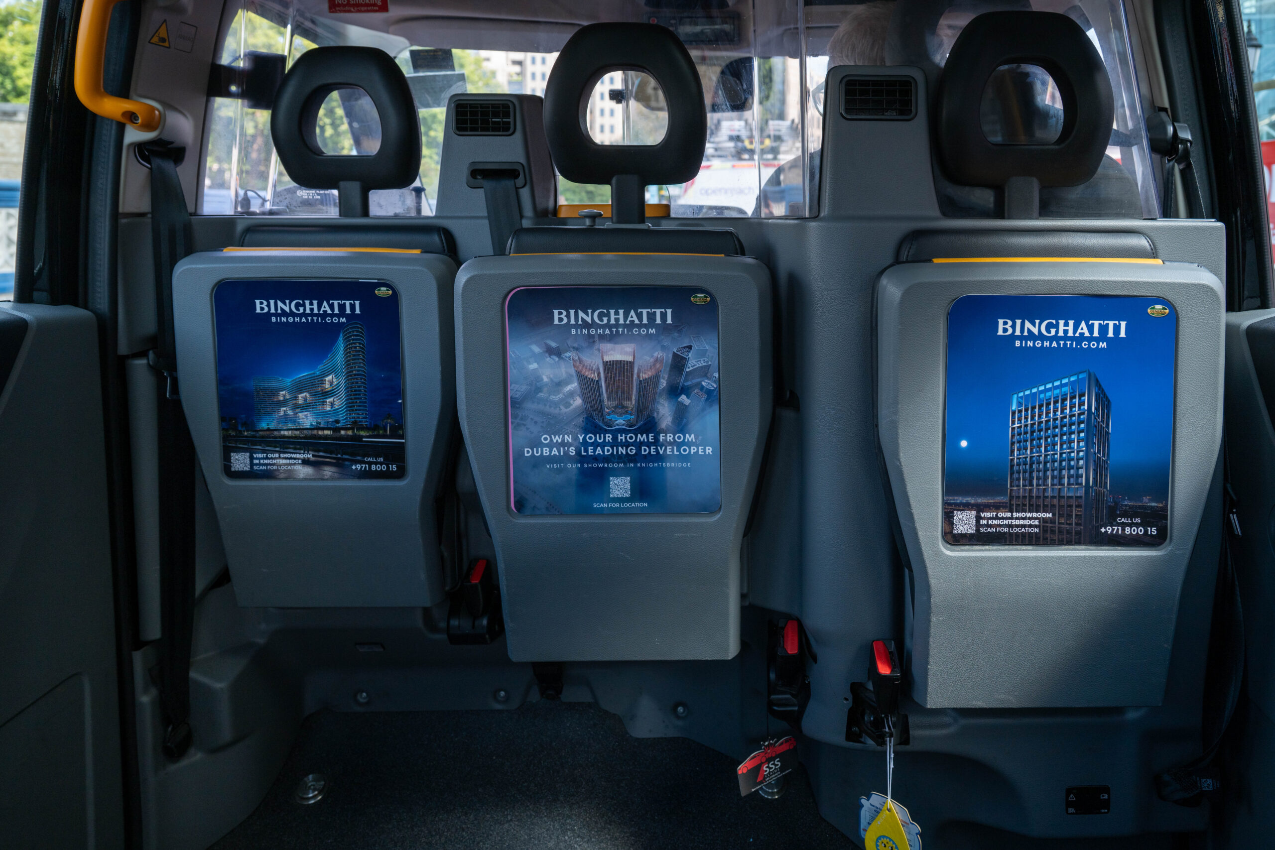 Binghatti Taxi Tip-Seats London - Excite Out Of Home An example of tip-seat advertising inside a London Taxi.