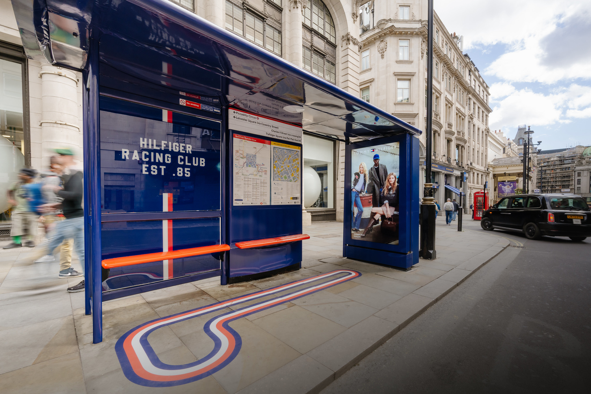 An example of Tommy Hilfiger taking over a bus stop in London with a creative activation.