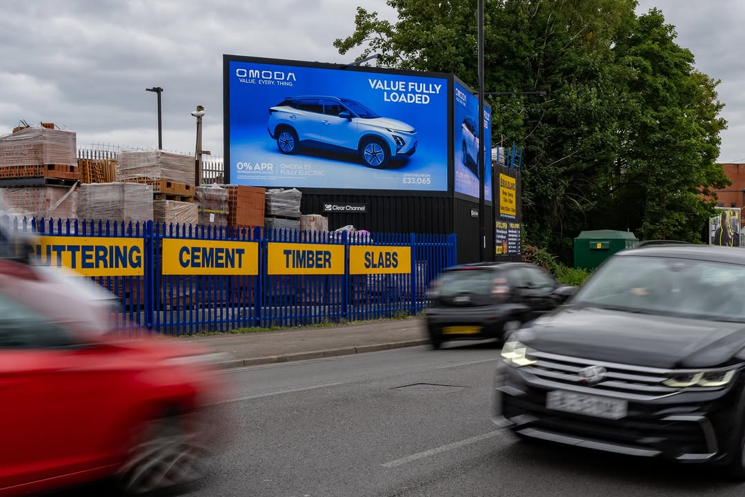 Car dealership advertising placed near retail parks and showrooms