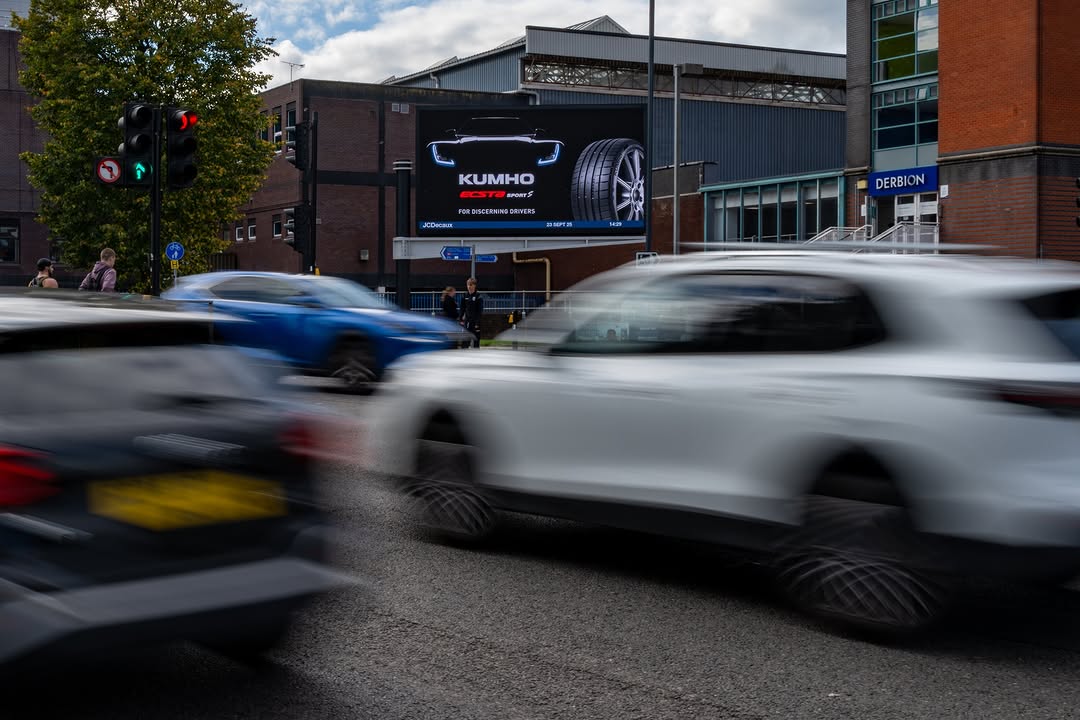 Car advertising campaign displayed on a digital out-of-home screen