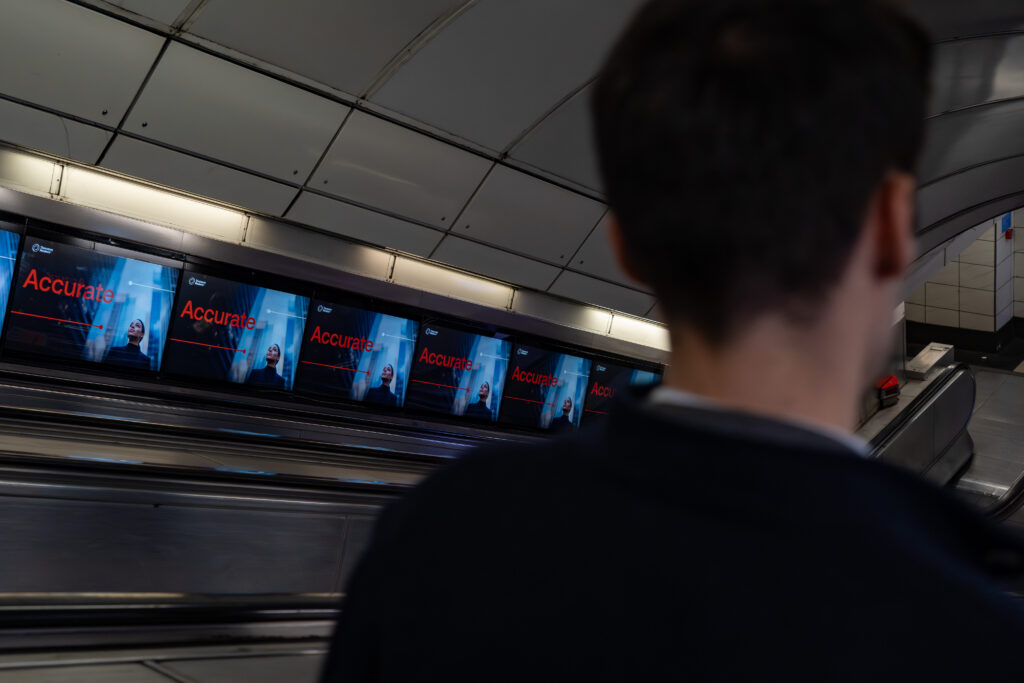 Digital ribbon advertising screens on a London Underground escalator