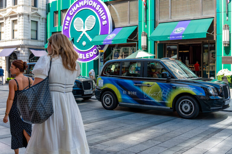 Hyatt Hotels branded London taxi advertising outside Wimbledon during The Championships